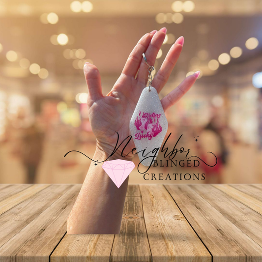 Resin Glittered Keychain- pink design feeling lucky- dice w flames on the other side