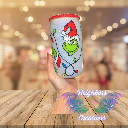 Double Wall Glass Grinch Christmas Cup With Green Bedazzled Lid with Red Trim around the Rim of the lid